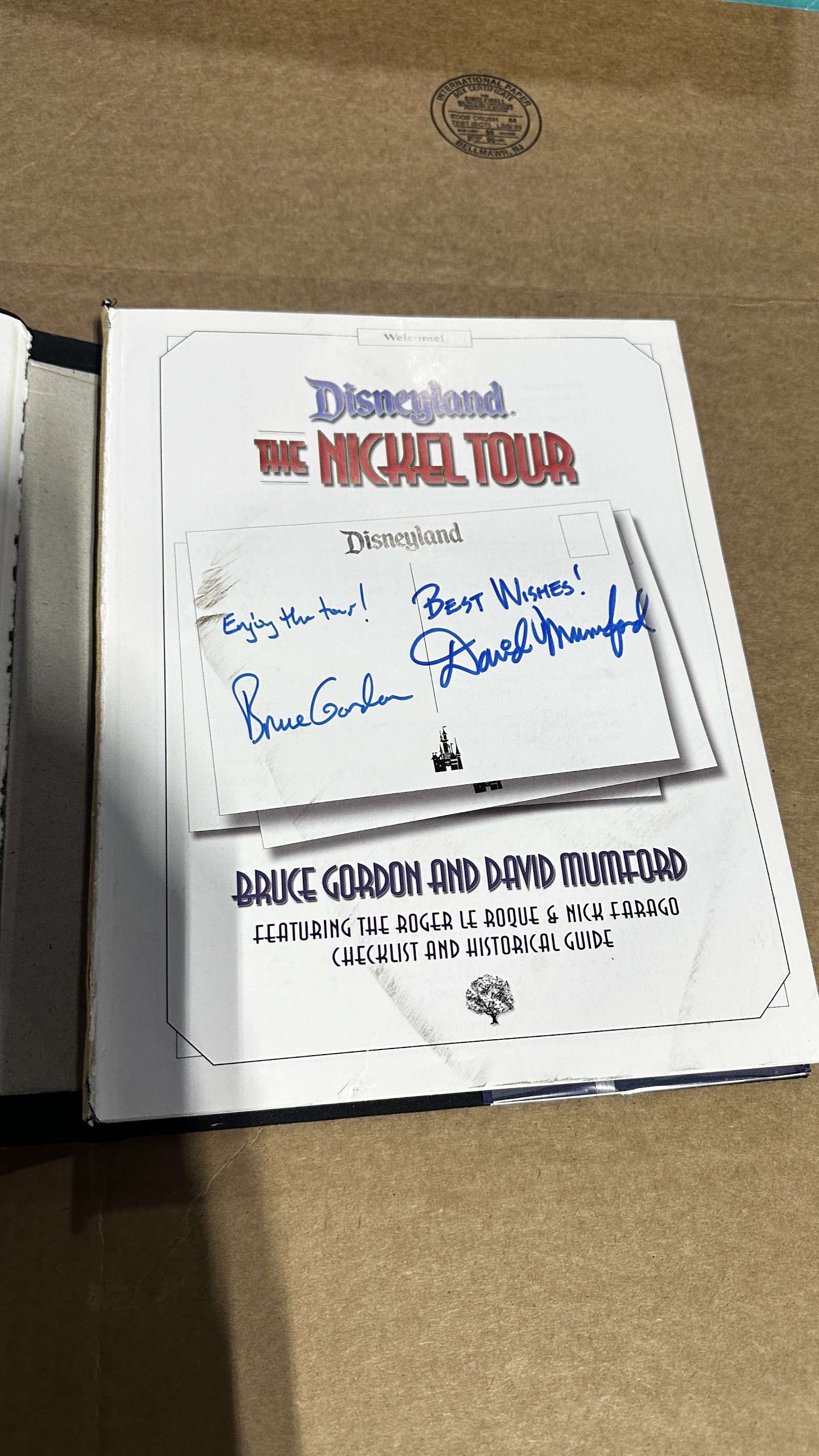 Vintage Disneyland "The Nickel Tour" souvenir book with worn cover and intact interior pages, circa 1950s–1960s