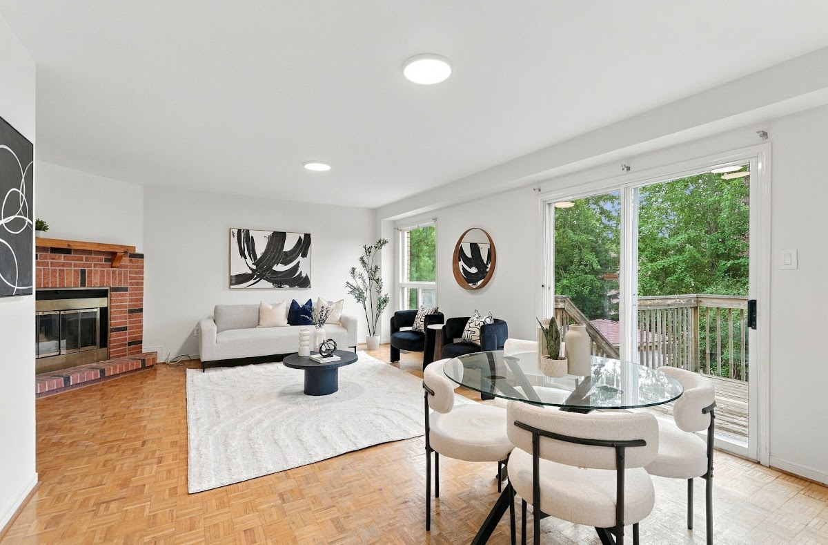 Family room with the brick fireplace and doors to the deck