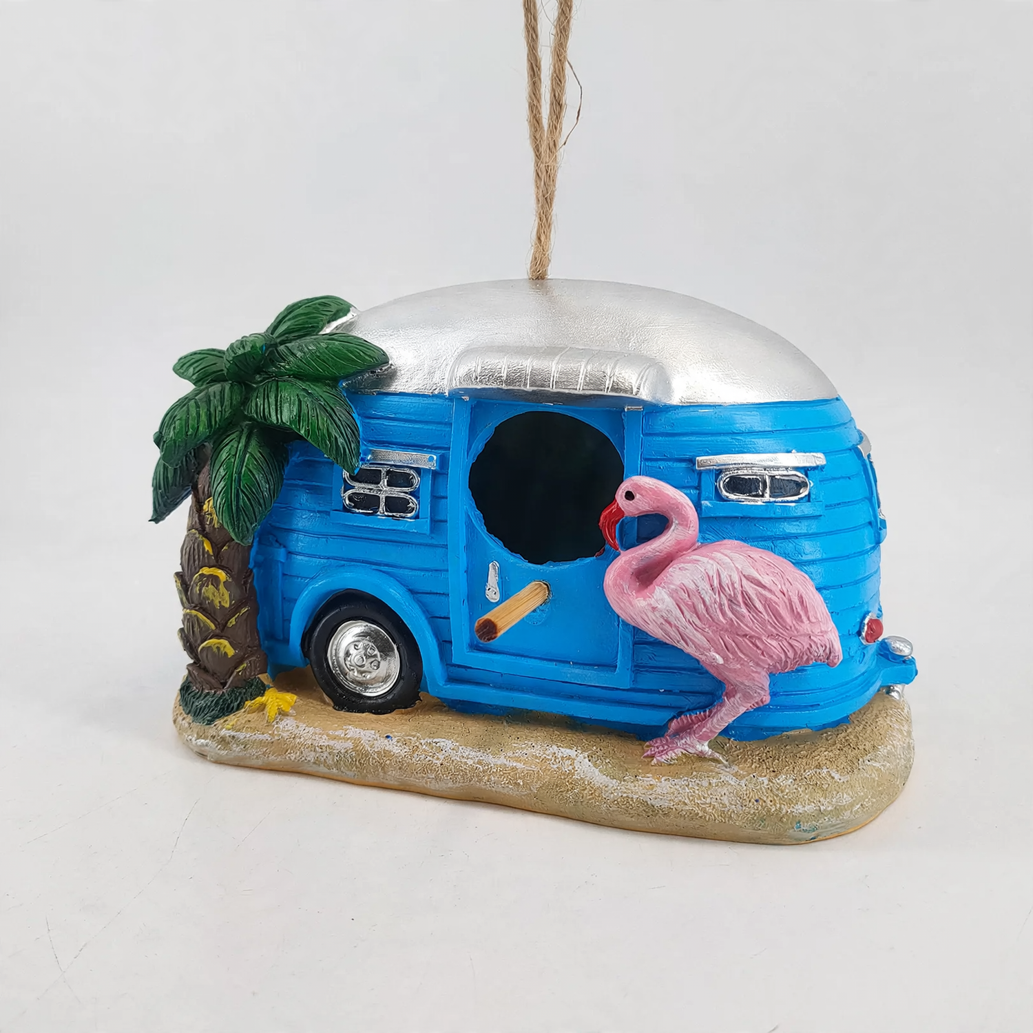 Decorative birdhouse in flamingo design made of synthetic resin