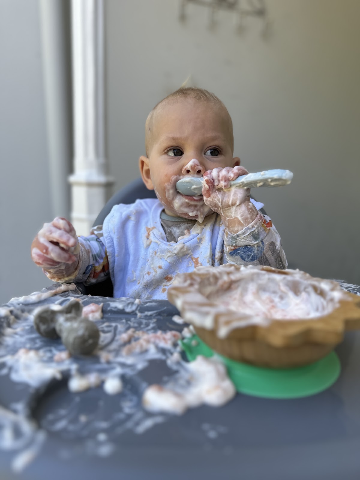 Baby exploring solid food during weaning