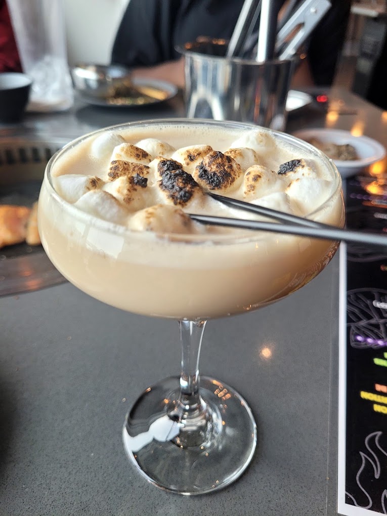 The bar at KPOP serves fun house cocktails, like this torched-marshmallow dessert drink