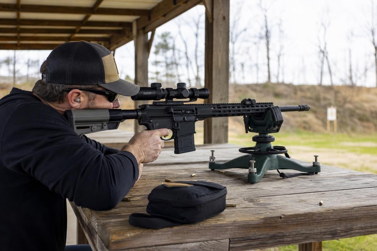 rifle scope zeroing setup with stable bench support
