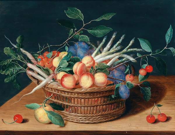 Apricots cherries plums radishes and asparagus in a wicker basket