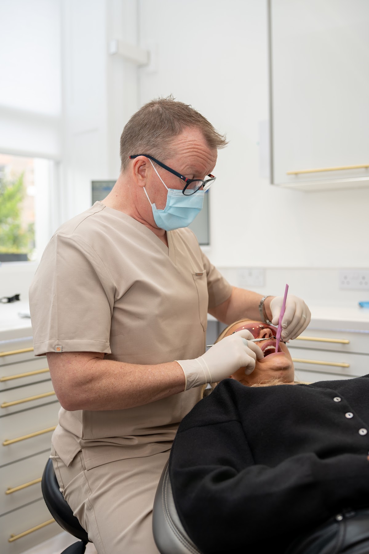 Dr. Barry Oulton treating a patient chairside