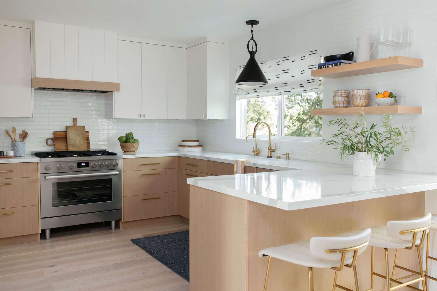 Modern kitchen with walnut cabinets and green island