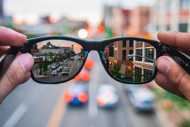 Sunglasses bringing a blurry street into focus