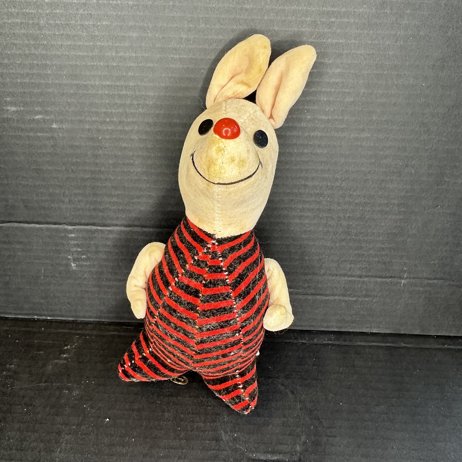 Vintage Piglet plush toy with cherry nose and striped pink romper, circa late 1960s to mid-1970s