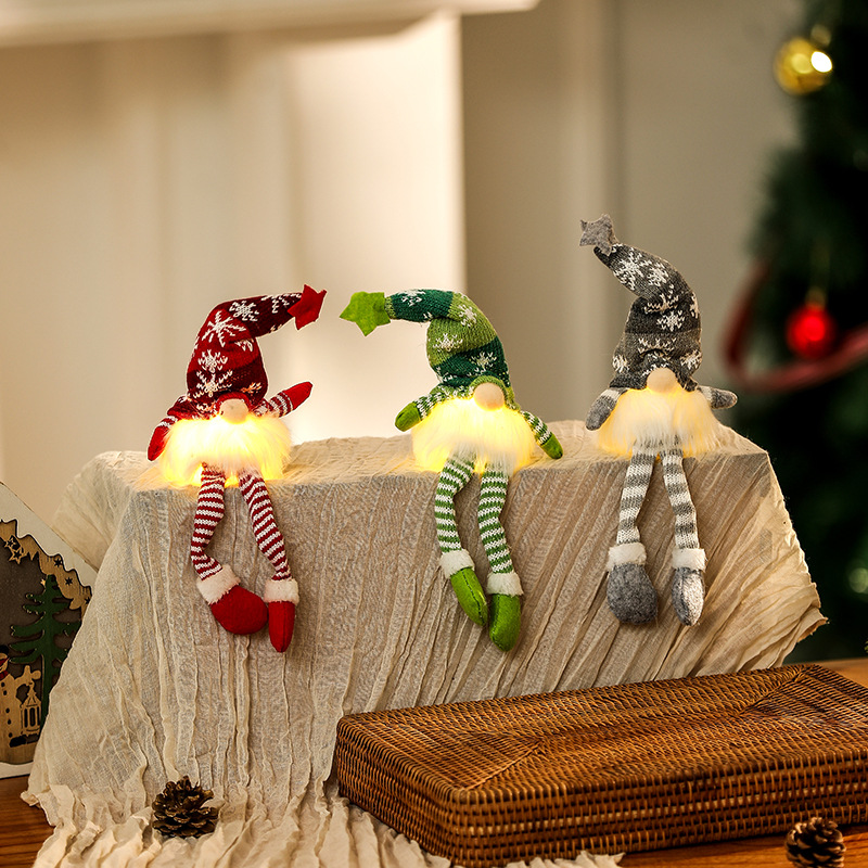 Illuminated gnome figure, sitting, with knitted hat