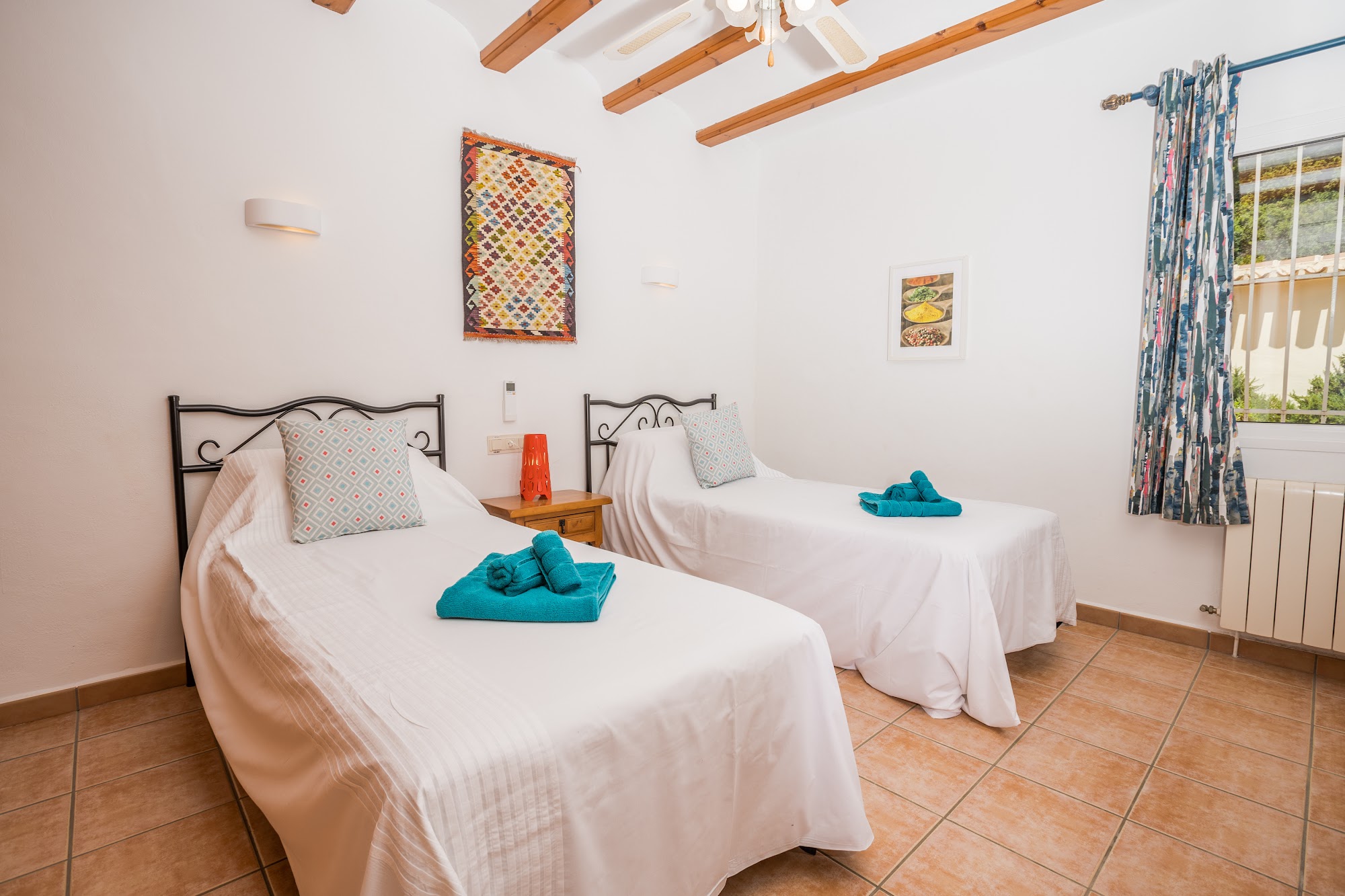 Second twin bedroom in soft whites