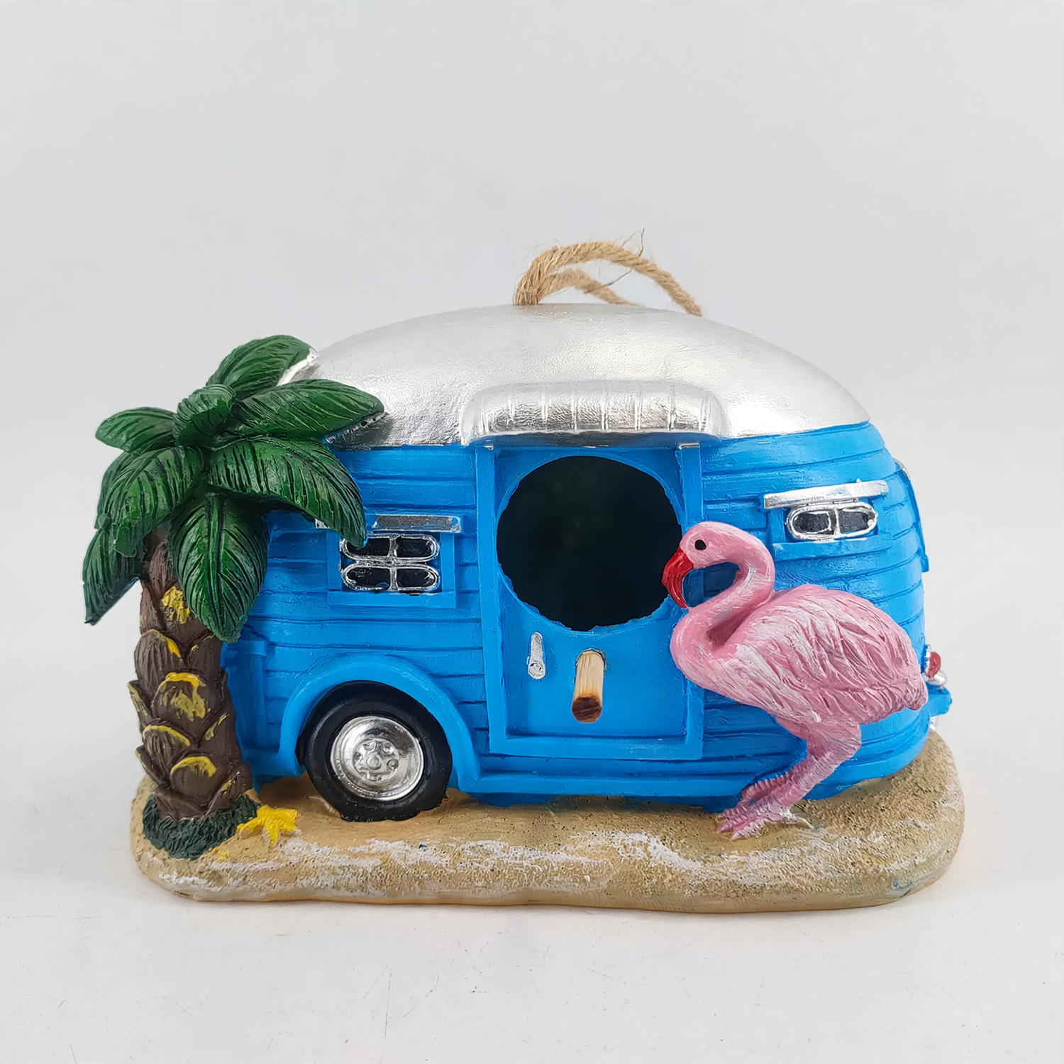 Decorative birdhouse in flamingo design made of synthetic resin