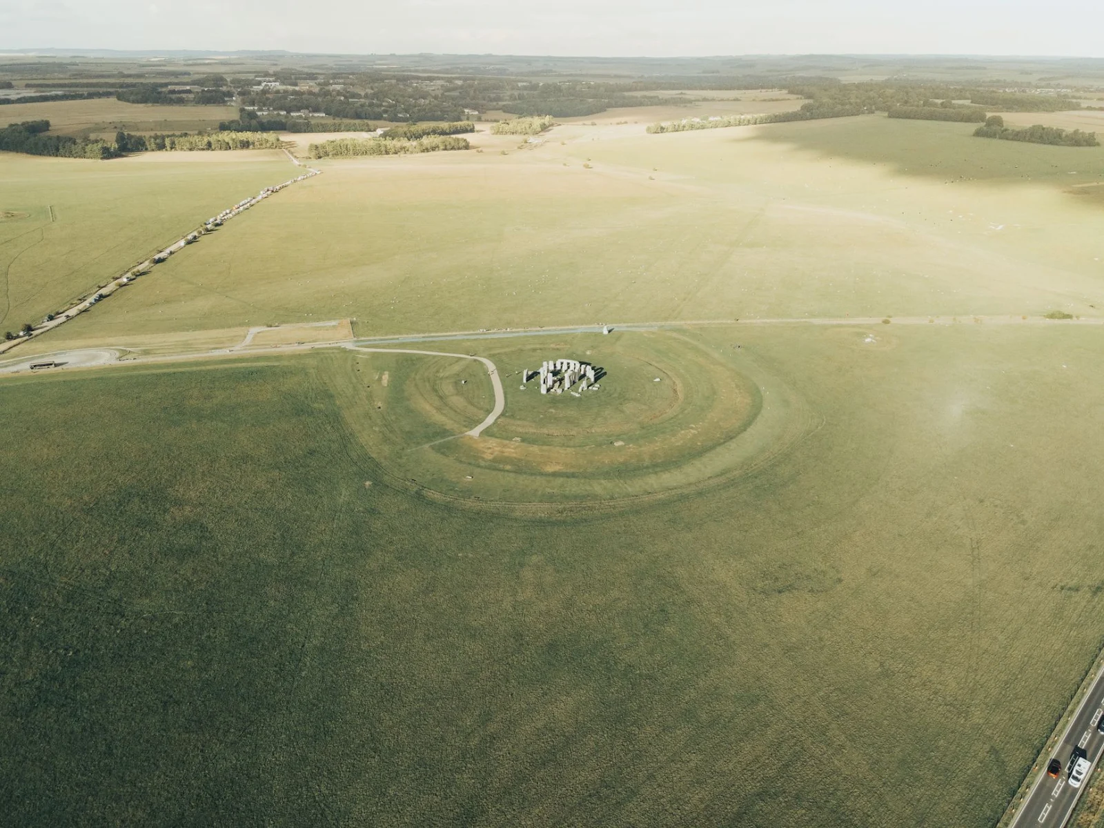 Drone shot capturing the historical Stonehenge site on Salisbury Plain, UK.