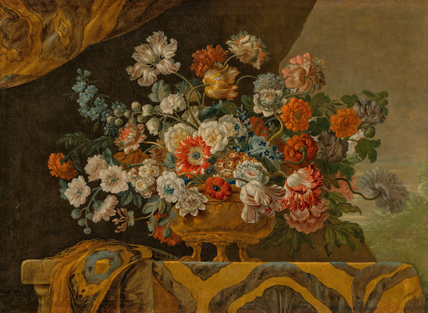 Tulips poppies roses anemones and other flowers in an urn on a draped stone ledg