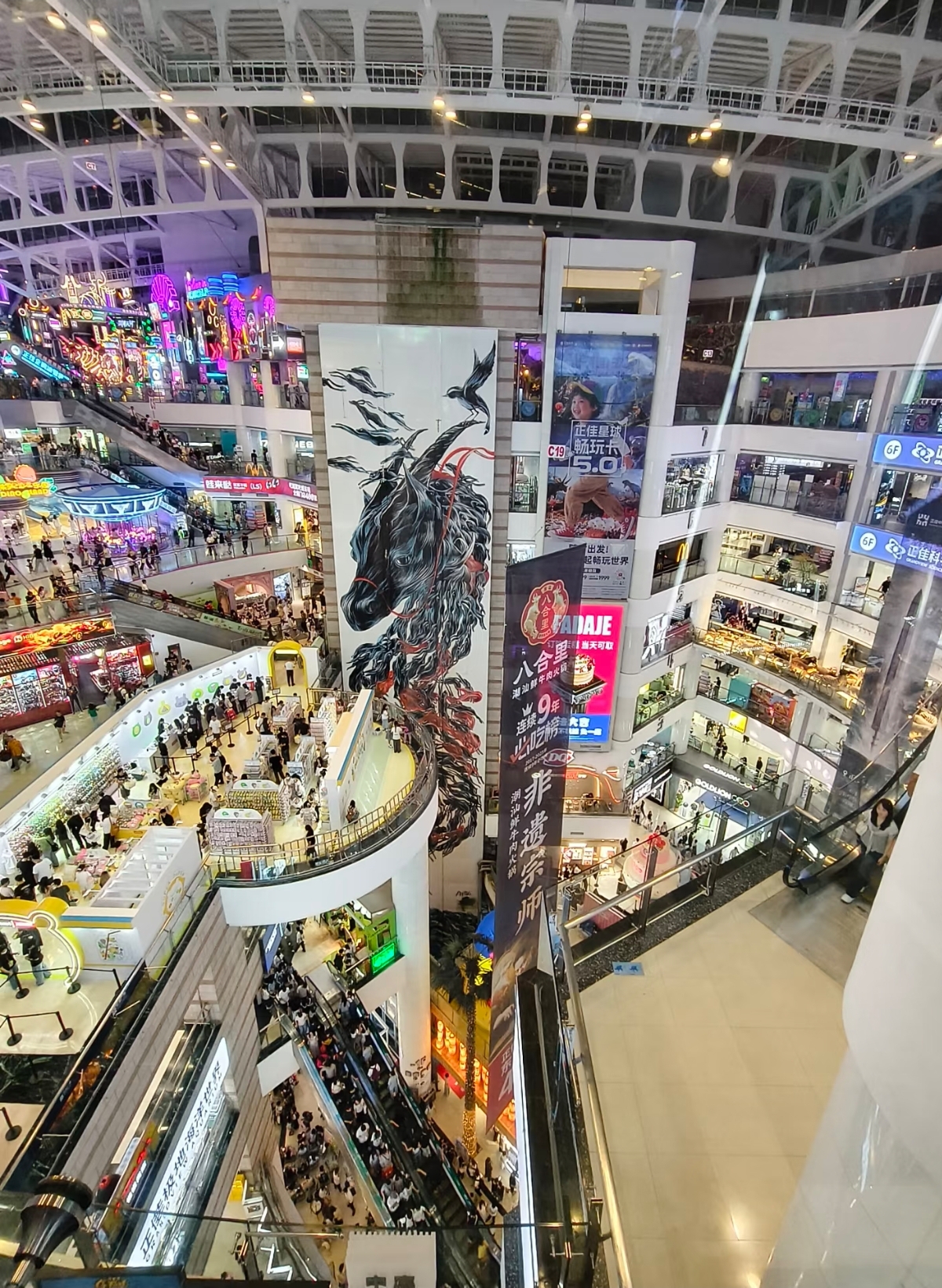 Lifestyle sneaker wall display at an international brand store in Taikoo Hui