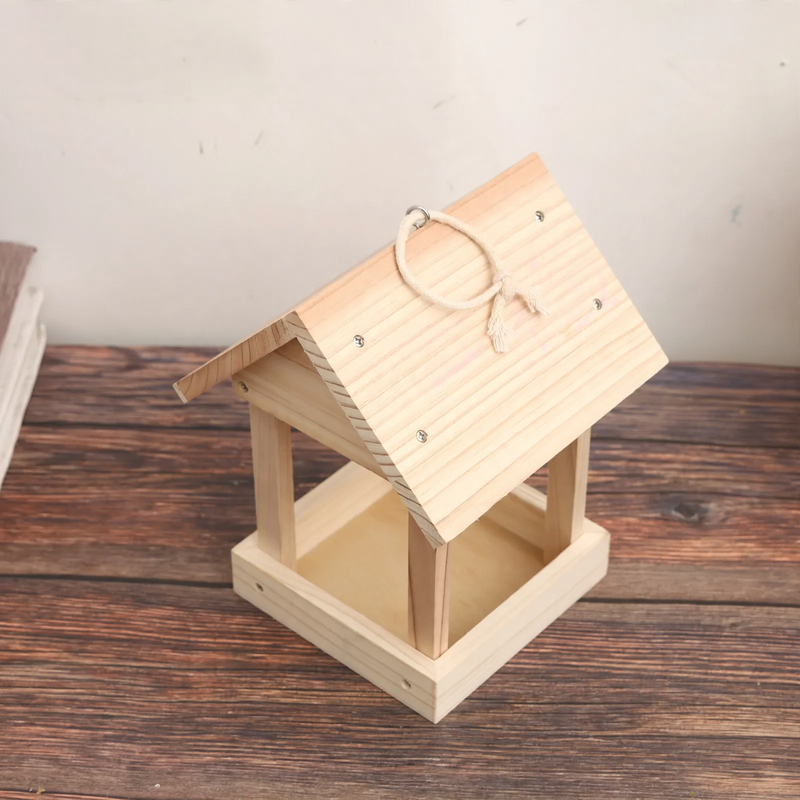 Open wooden birdhouse as a feeding station