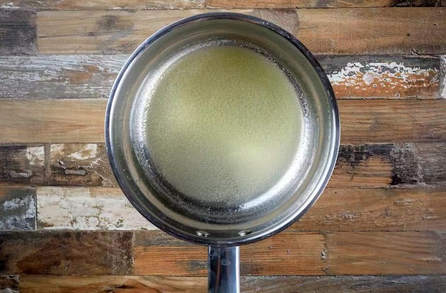 Melting butter in a saucepan for slow cooker potato soup prep