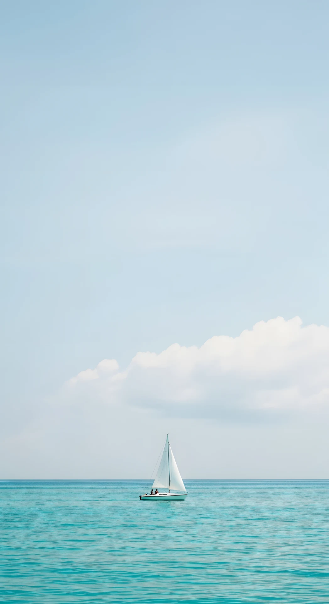 Minimalist Photograph of a White Sailboat on a Calm Turquoise Ocean Under a Soft Sky - Free 4K mobile Wallpaper