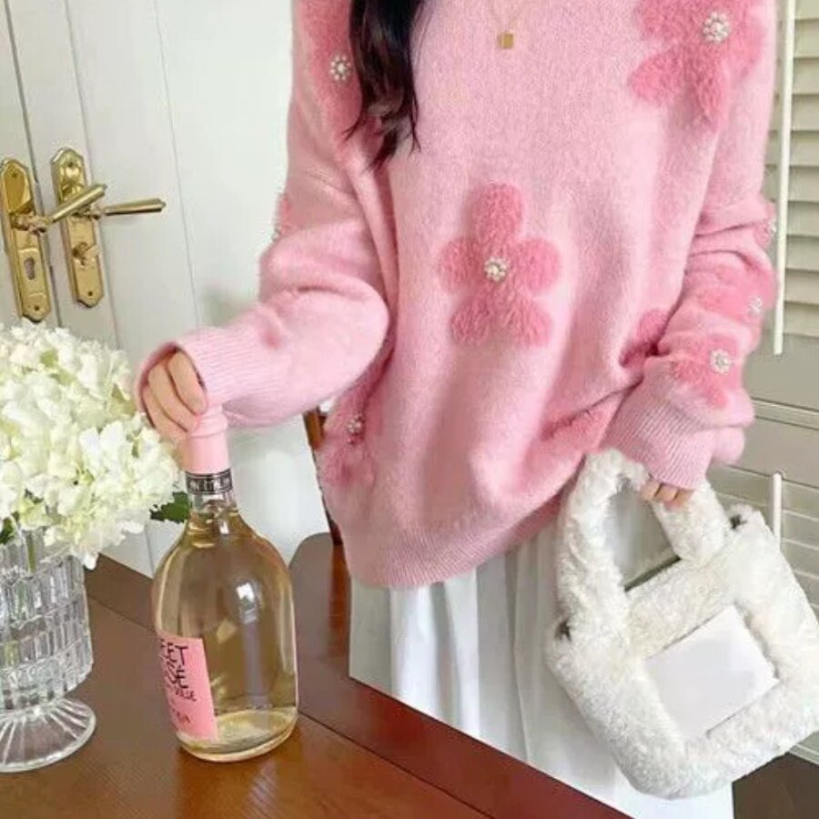 Women's knitted sweater with floral pattern and pearl embellishment