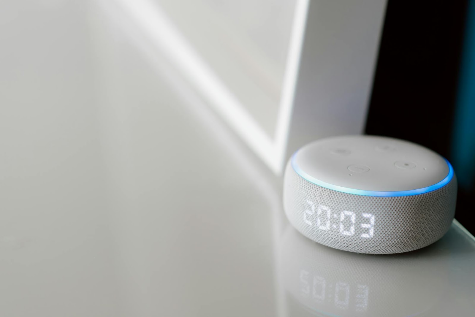 A person looking frustrated while trying to connect or troubleshoot multiple smart home devices, highlighting common IoT problems and the smart home trap.