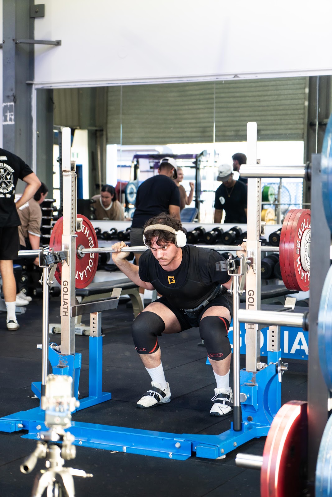Athlete squatting at Storiestrong HQ