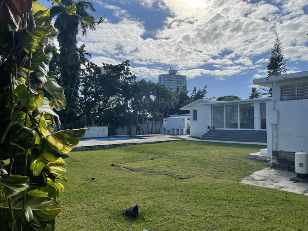 Backyard and pool with the San Juan-area skyline in the distance