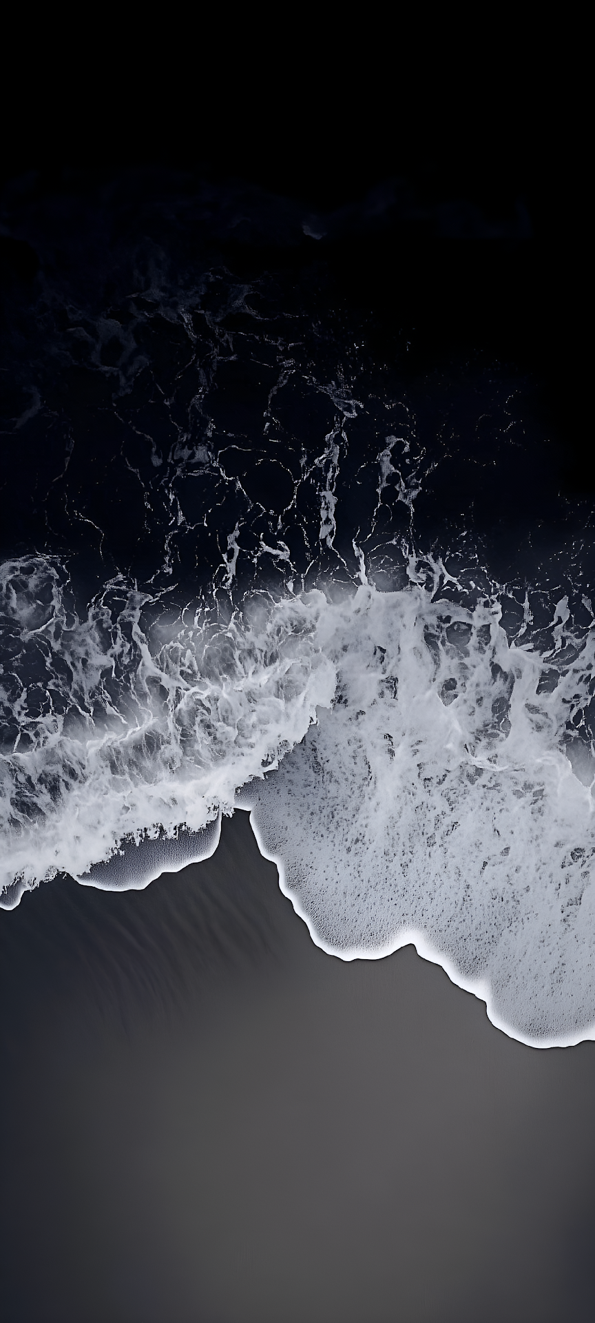 Aerial View of White Ocean Foam on Dark Black Sand Beach - Free 4K mobile Wallpaper