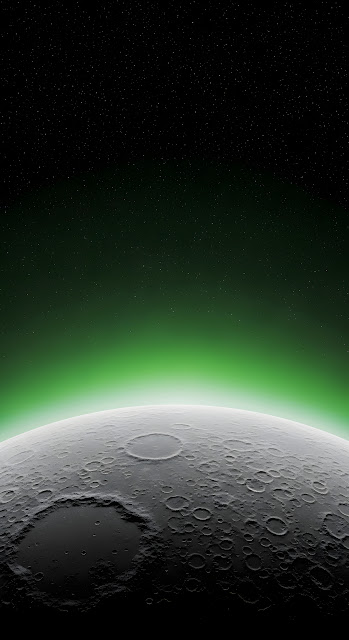 Cratered Lunar Surface with Green Aurora Glow in Space - Free mobile Wallpaper