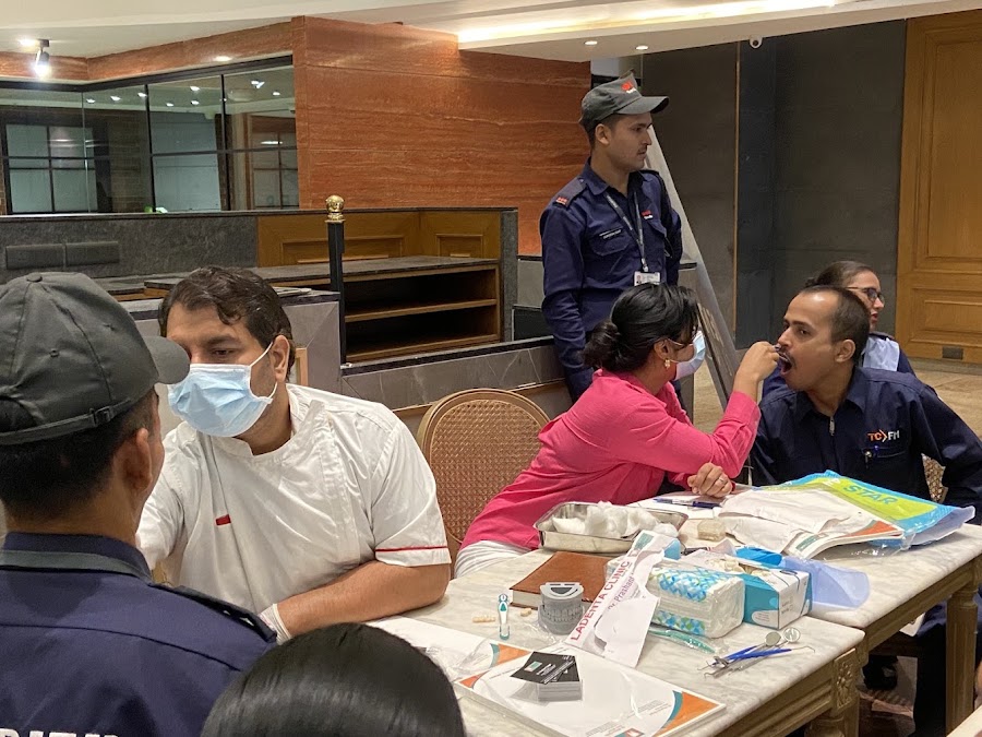 Dr. Shilpa Yadav examining a patient at a free dental camp