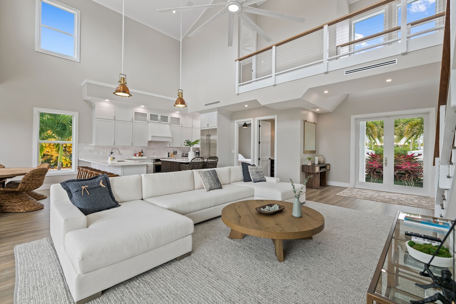 A classic tropical Florida Keys vacation home with lush vegetation and a private pool, the island streetscape behind