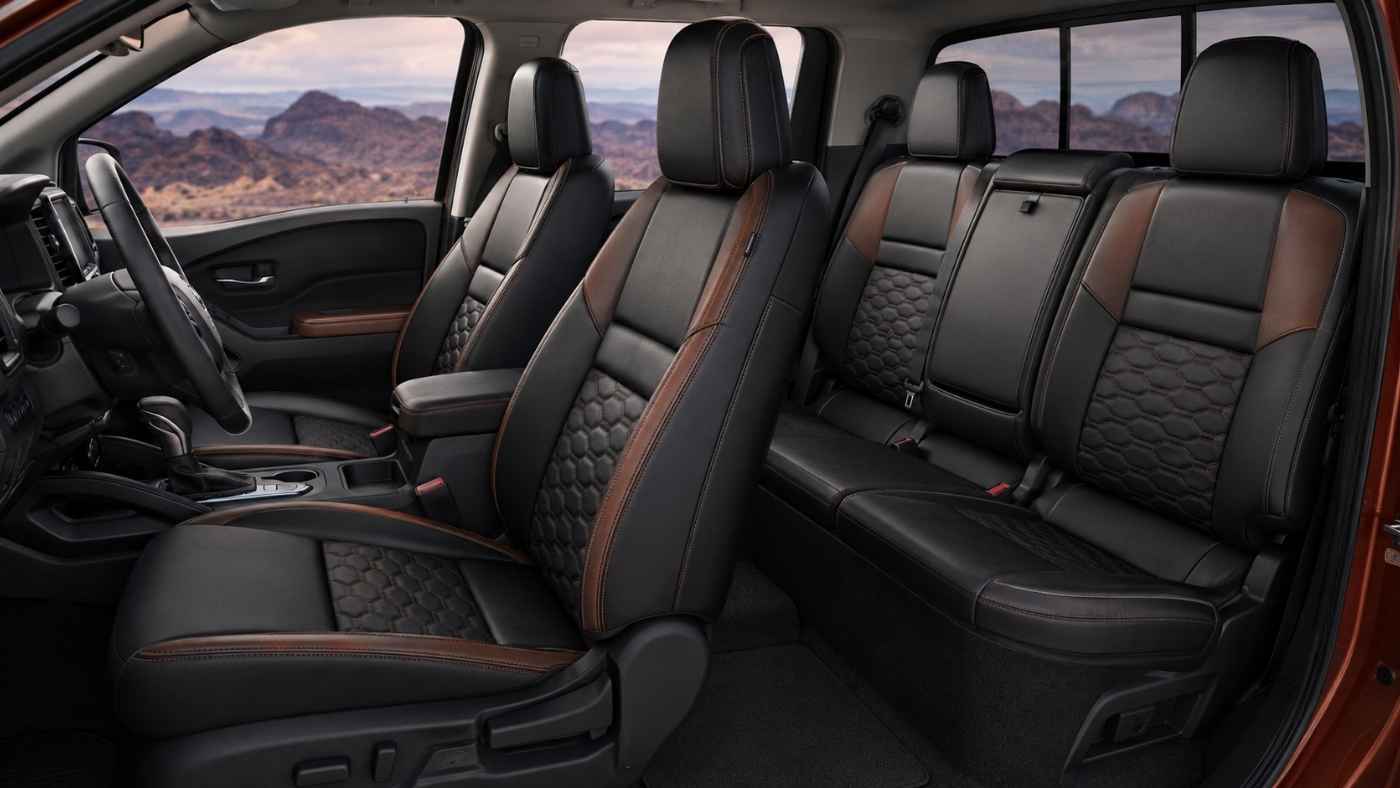 2026 Nissan Frontier interior with leather-style seats, showing trim comfort and seat cover fitment for daily driving.