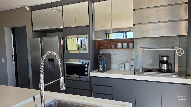 Foto 12 de Casa com 4 Suítes, lote de esquina e com vista para Represa