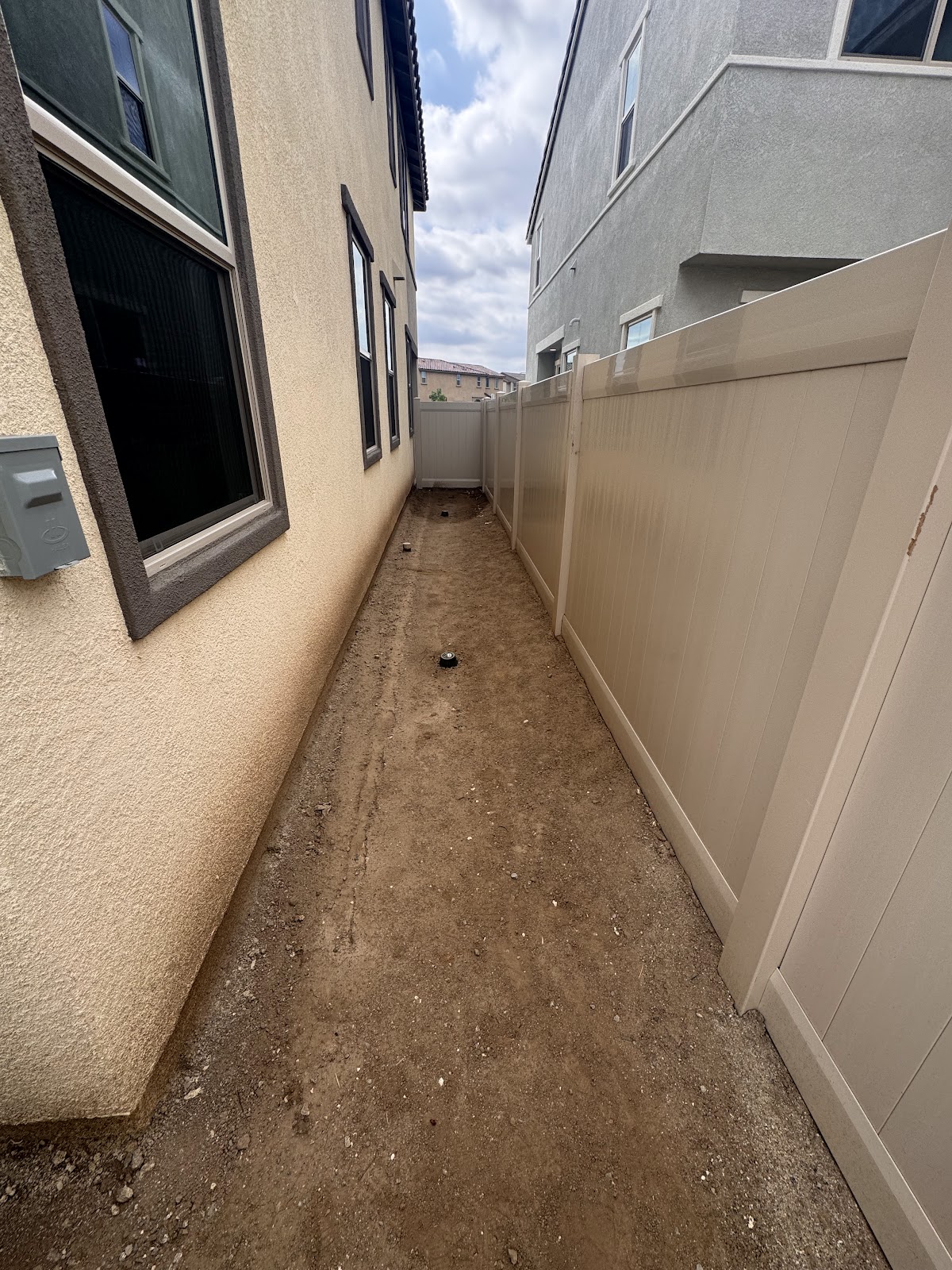 Completed backyard project with turf and hardscape