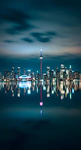 Toronto Night Skyline Reflection Across Calm Lake Water