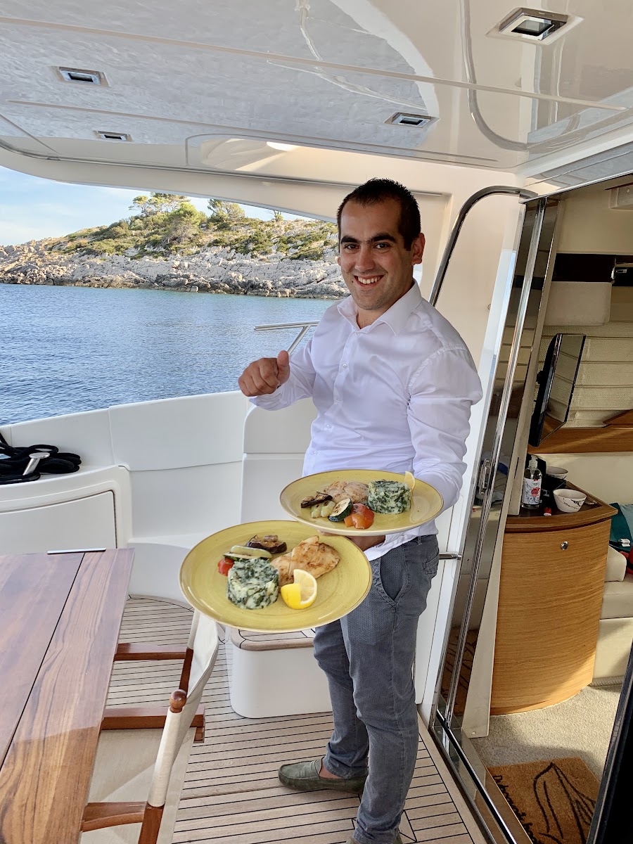 Crew serving food on board