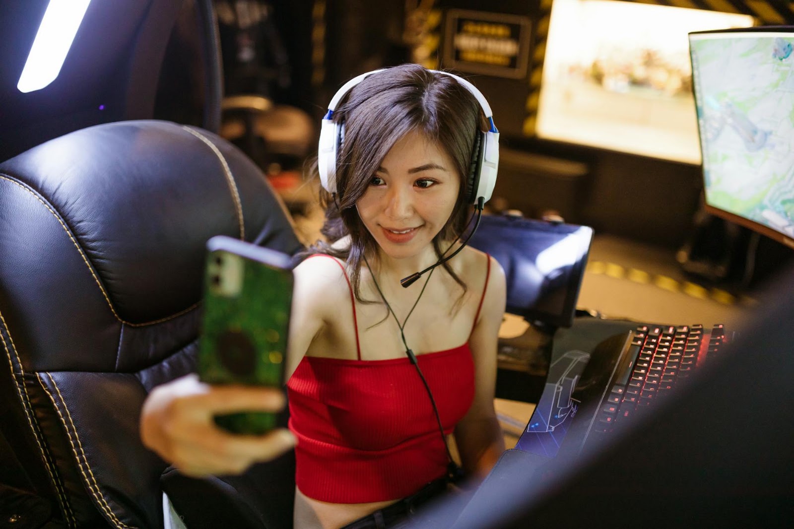 A woman smiling while virtually trying on clothes using a smartphone app, powered by AI Virtual Try-On.
