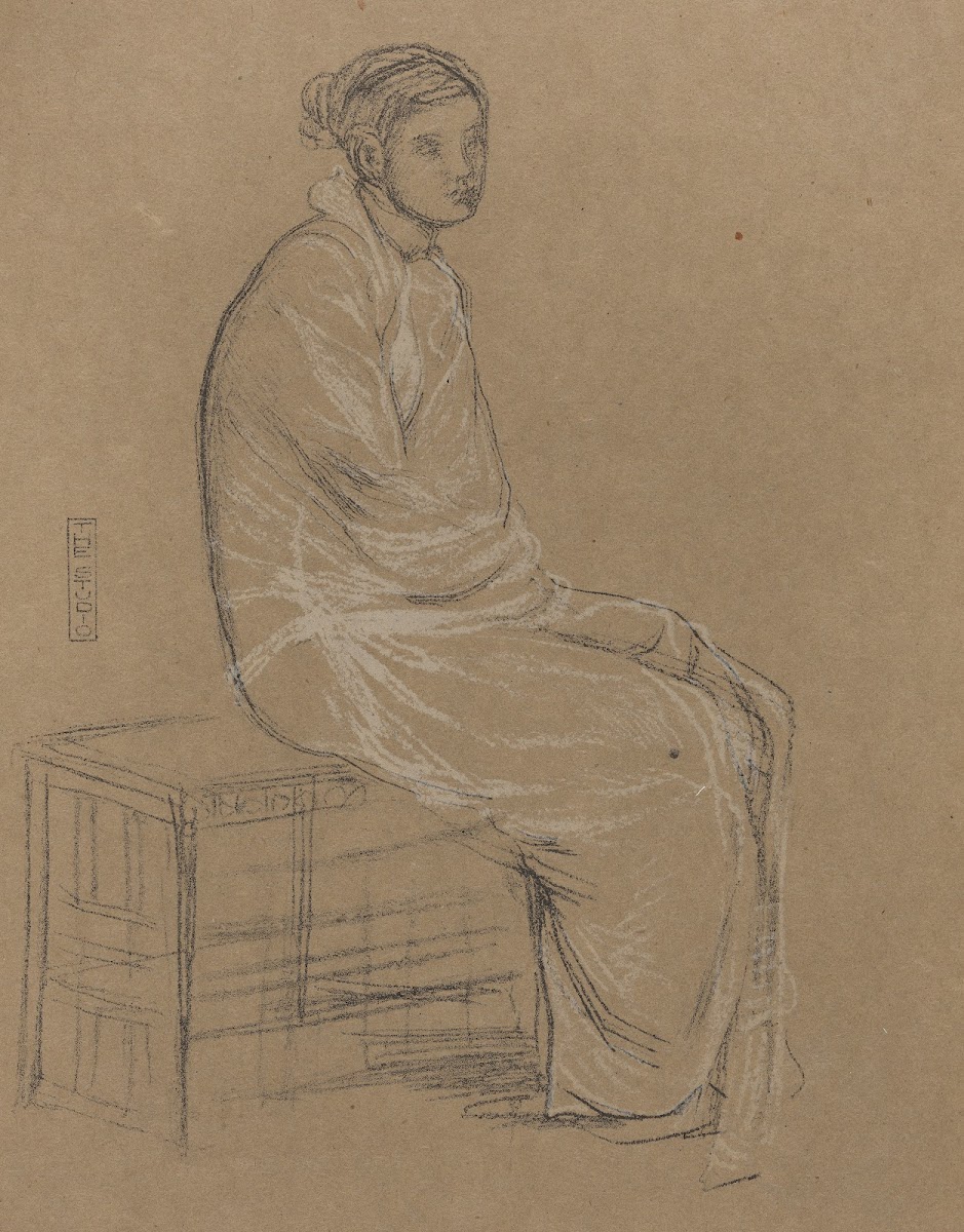 Woman seated on bench wrapped in white robe