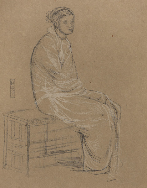 Woman seated on bench wrapped in white robe