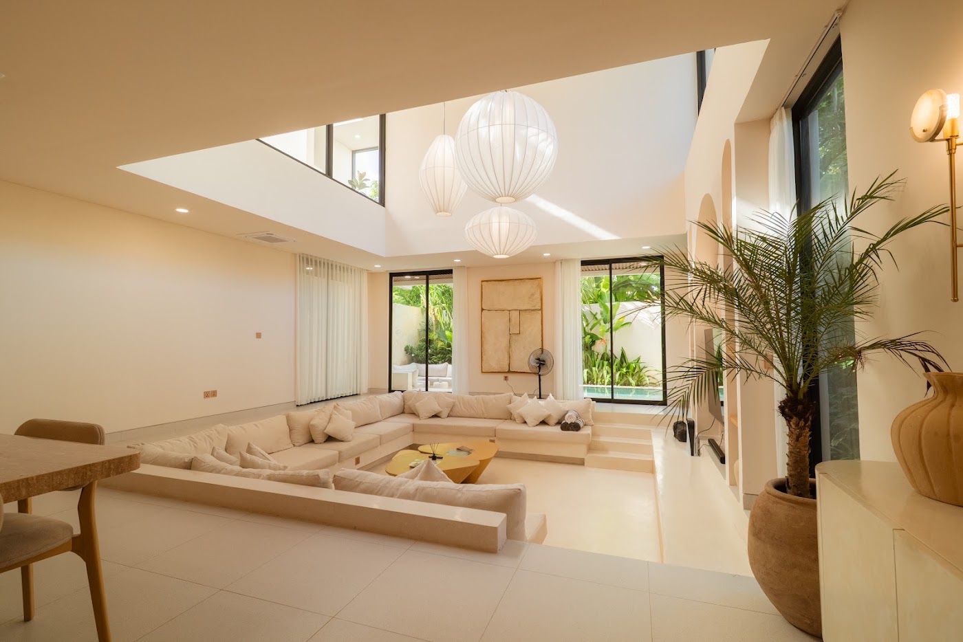 Sunken living room with paper pendant lights at La Calma villa Uluwatu