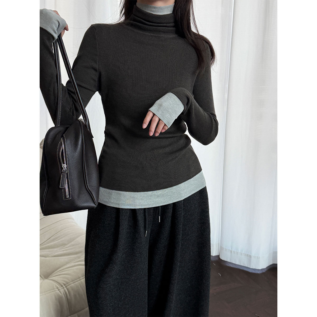 Women's knitted pullover with stand-up collar and contrast details