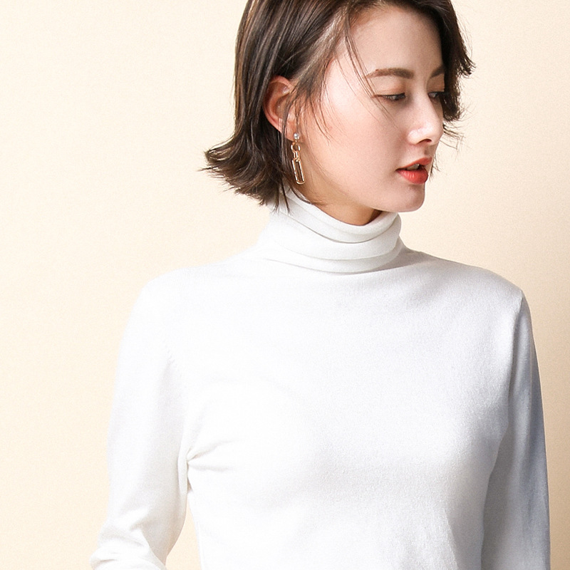 Women's knit sweater with standing collar and geometric pattern