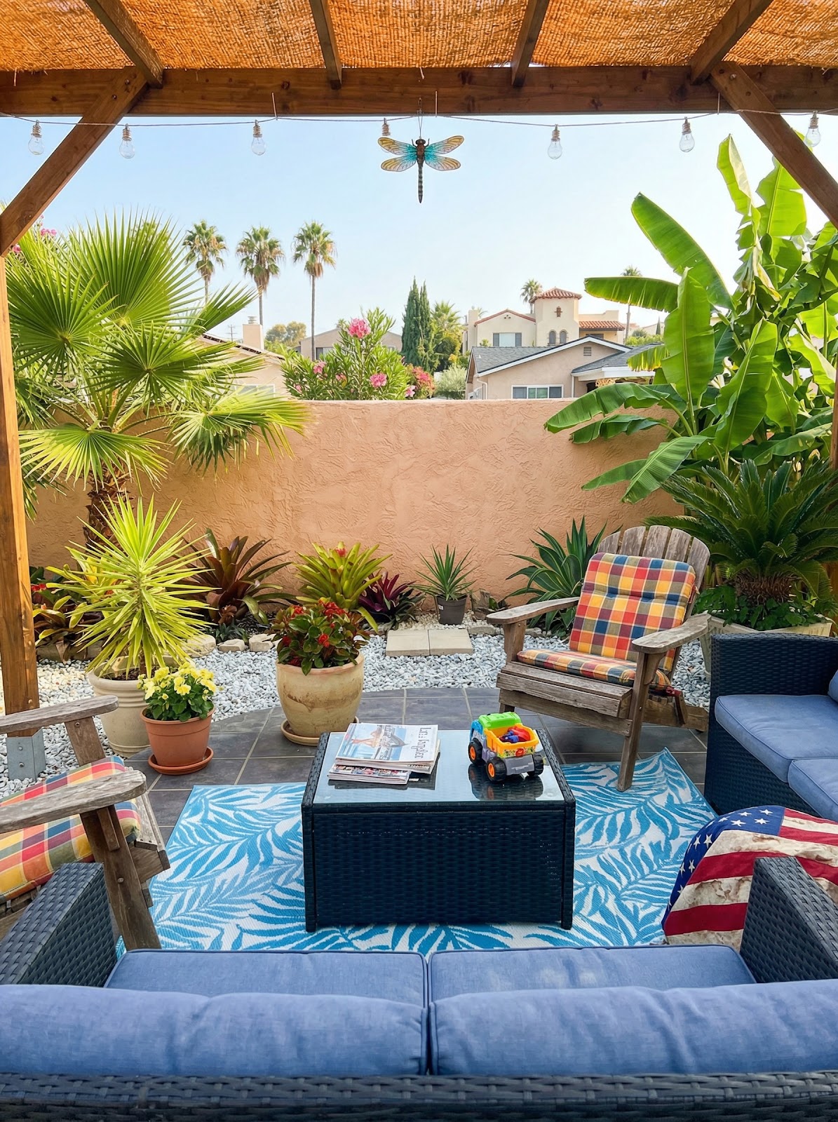 Pergola coir shade cover with string lights and tropical patio plants