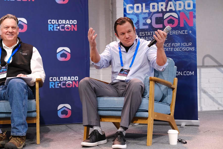 Speaker on stage at a past Colorado RE•CON event