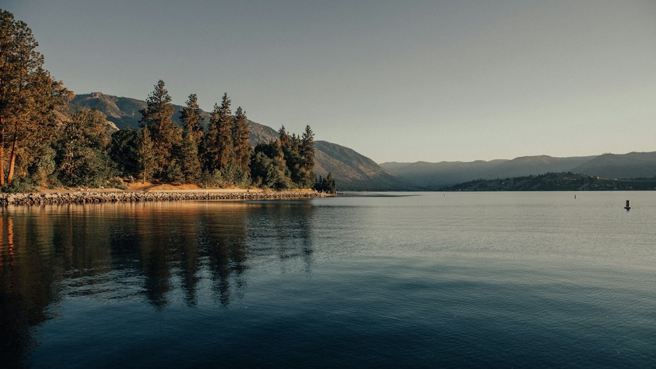 Deep blue waters of Lake Chelan stretching between forested Cascade mountains toward remote Stehekin