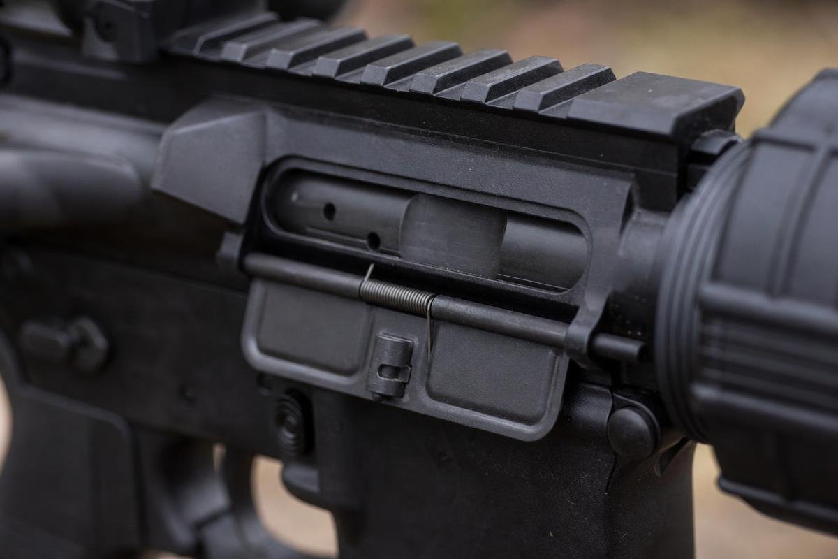 AR-15 dust cover installed on a standard upper receiver