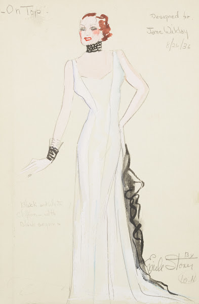On Top Designed for Jane Wilday White gown with black ruffle and black collar an
