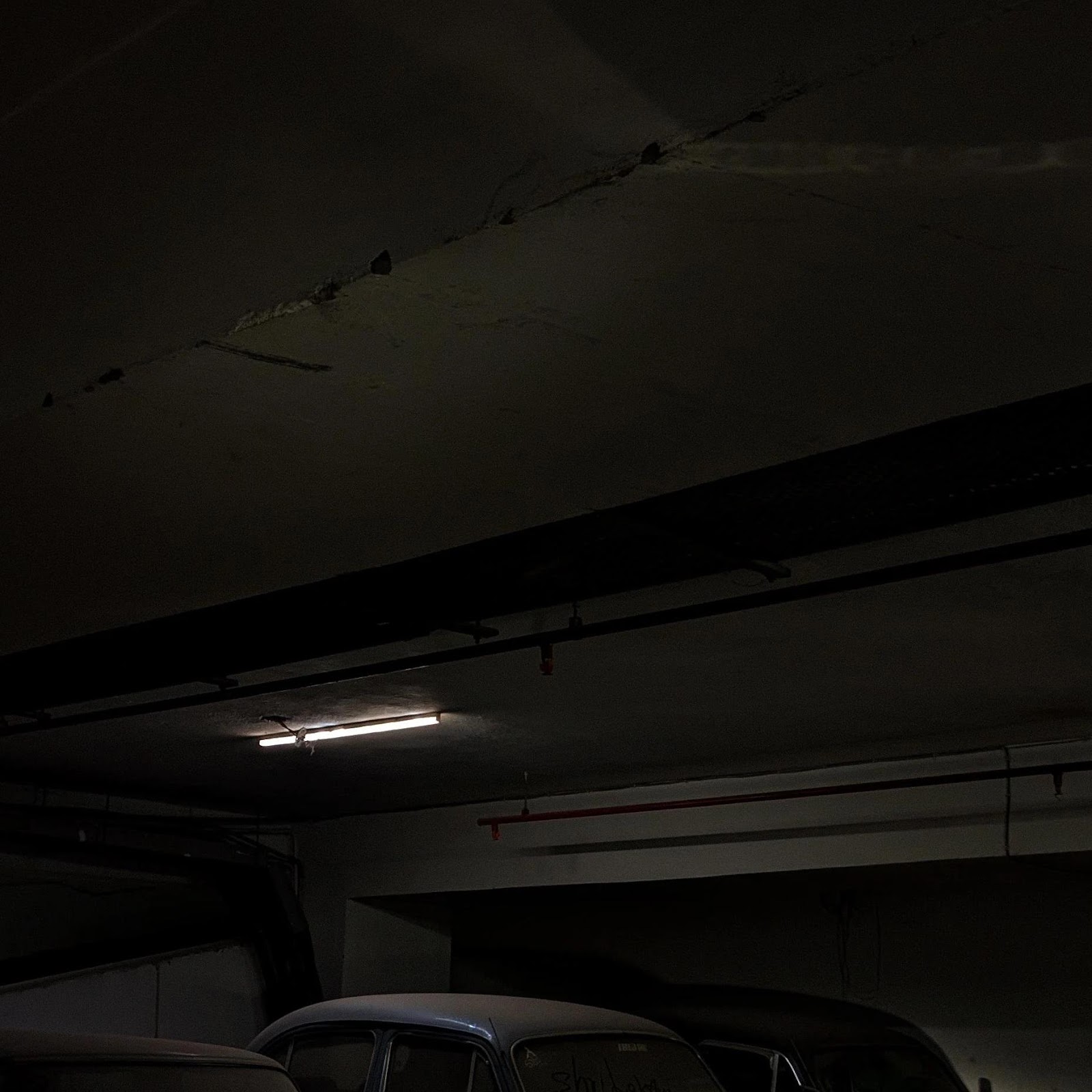 Download Dusty Vintage Cars In Dark Garage 2K iPhone