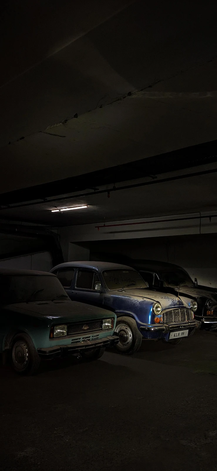 Dusty Vintage Cars In Dark Garage - Cinematic Low Key 2K iPhone Wallpaper (1860x4029)