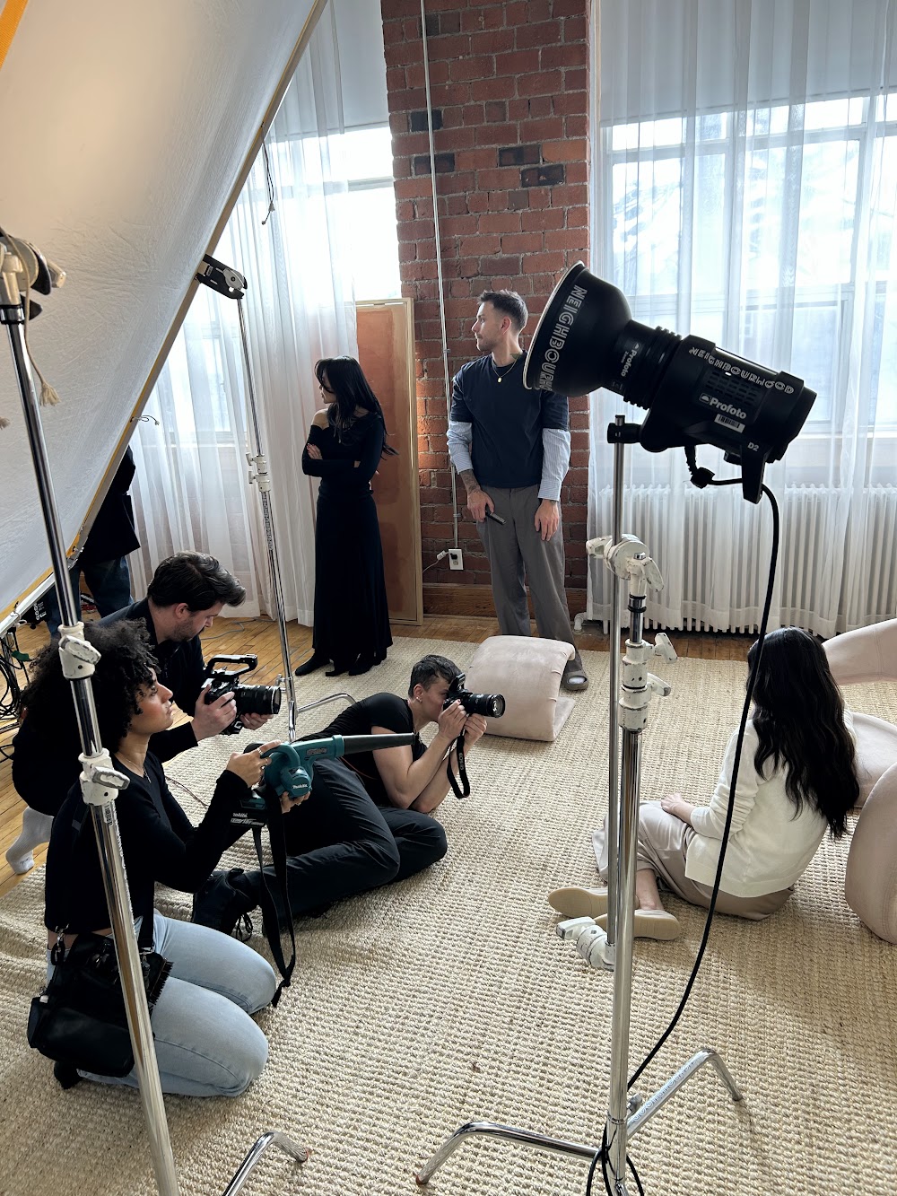 Stylist with a leaf blower on a hair shoot