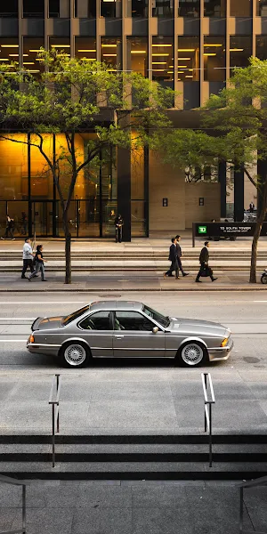 Classic BMW Coupe In Downtown 2K iPhone Wallpaper Background