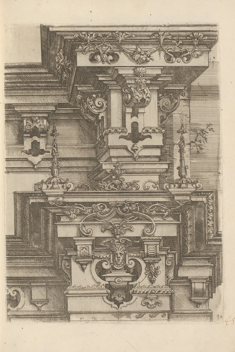 Two composite capitals with two crowns and decorated with foliage volutes and a