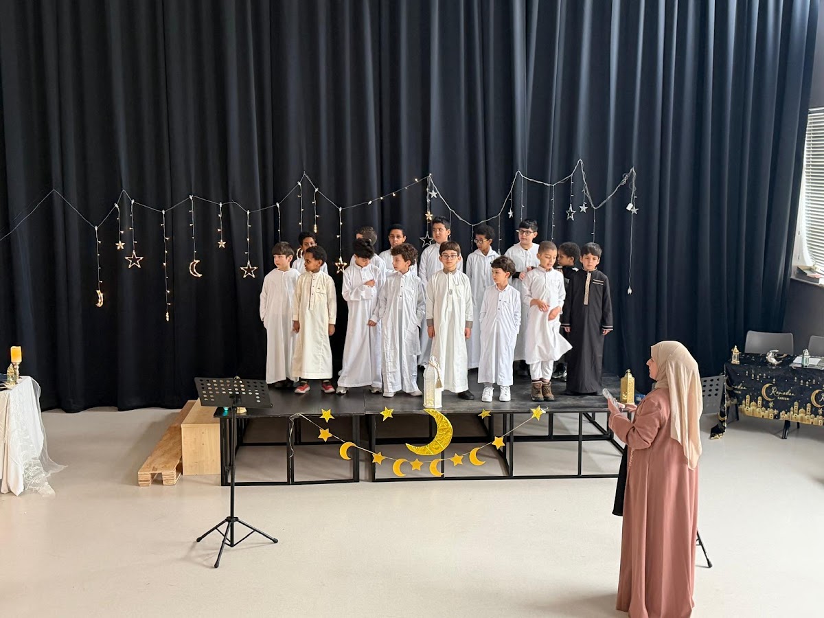 Boys performing a nasheed on stage